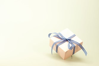 Gift box with a bow tied around it